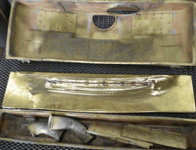 Corrosion removed from parts, and a new header plate, for a 1930 Lasalle radiator recore.